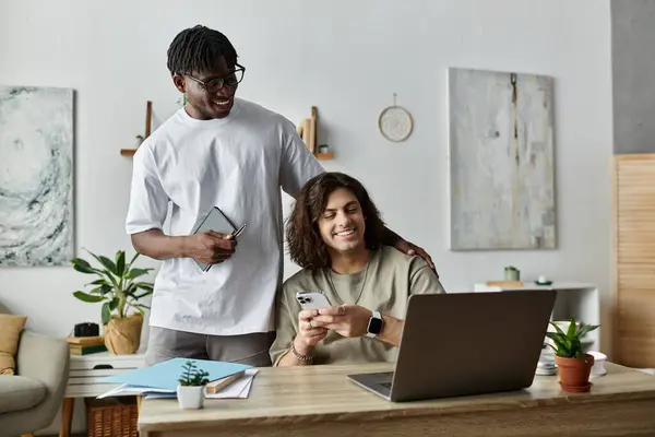 Two partners smile and connect with their devices, surrounded by a cozy home environment. — Stock Photo