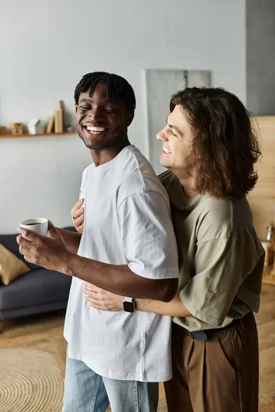 A warm moment shared between two partners as they embrace lovingly in their home. — Stock Photo