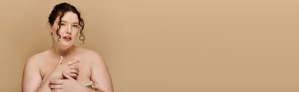 A confident plus size woman poses gracefully, highlighting her unique beauty and strength. — Stock Photo