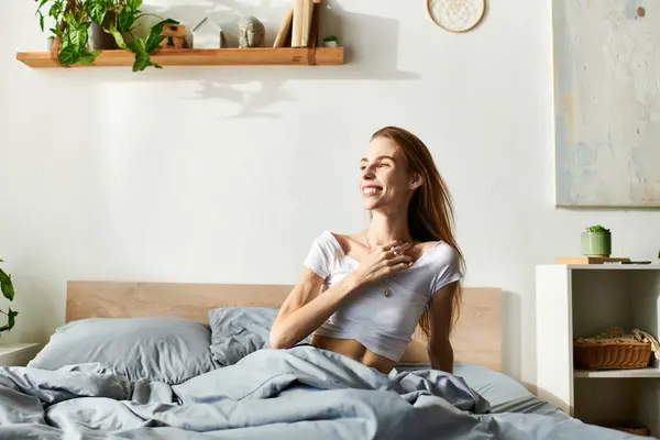 A young woman, battling anorexia, shares a moment of joy and self-reflection in her peaceful bedroom. — Stock Photo