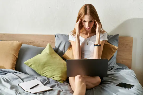 A young woman with anorexia engaged with her laptop and feeling stress — Stock Photo
