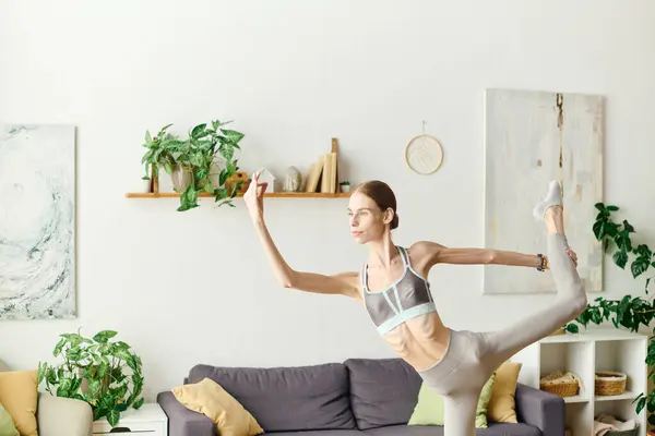 A young woman with anorexia passionately works out at home, balancing her fitness goals with her personal health journey. — Stock Photo