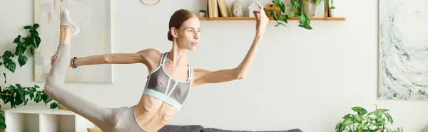 In a serene home environment, a young woman with anorexia engages in yoga, emphasizing her journey toward wellness and inner strength. — Stock Photo