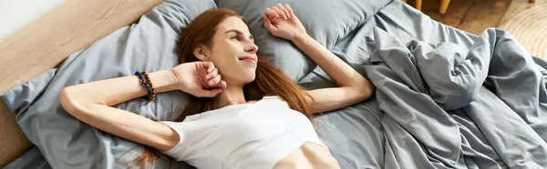 A young woman with anorexia, relaxes in her cozy bedroom, lost in thought. — Stock Photo