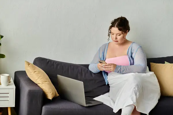 Beautiful young woman in cozy homewear enjoys a relaxed day at home. — Stock Photo