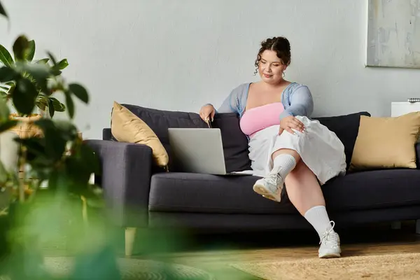 Appealing young woman in cozy homewear enjoys a relaxed day at home. — Stock Photo