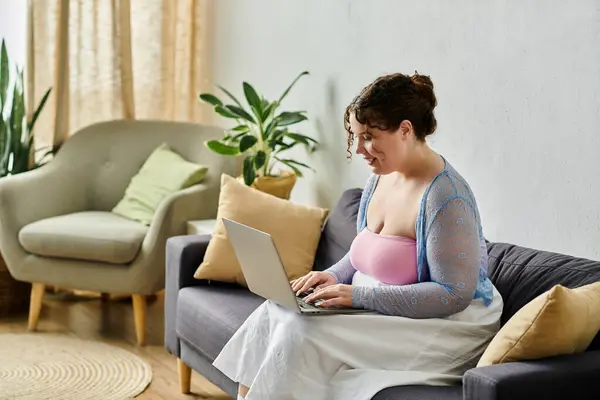 Elegant young woman in cozy homewear enjoys a relaxed day at home. — Stock Photo