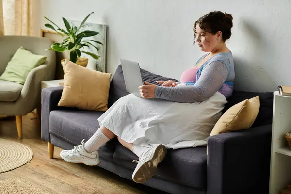 Joyful young woman in cozy homewear enjoys a relaxed day at home. — Stock Photo