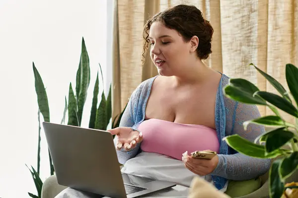 Happy woman holding her laptop while at home. — Stock Photo