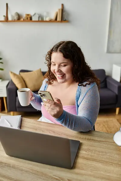 Cheerful woman with dark hair working at home. — Stock Photo