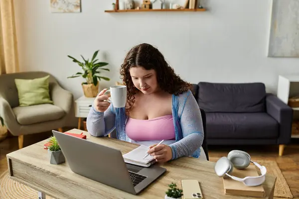 Hard working woman with dark hair working at home. — Stock Photo