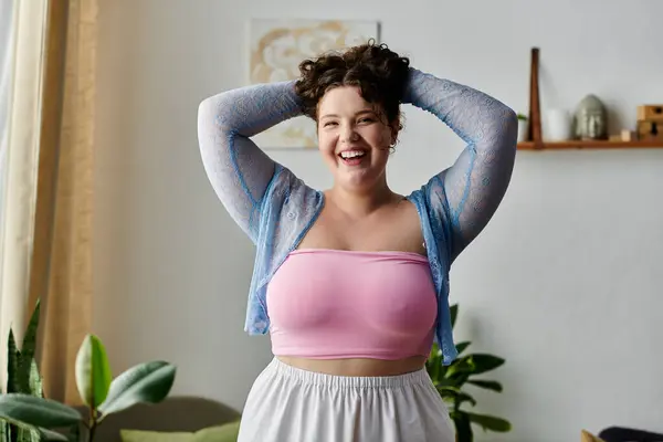 Joyful woman with dark hair and cozy attire spending time at home. — Stock Photo
