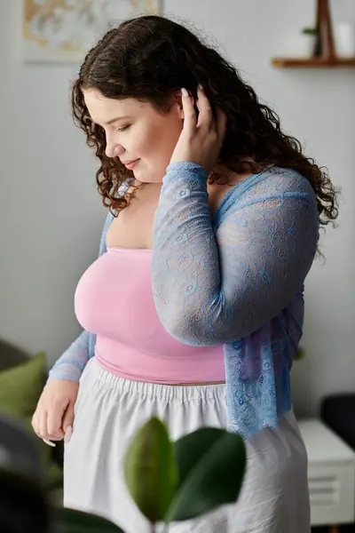Beautiful woman with dark hair and cozy attire spending time at home. — Stock Photo
