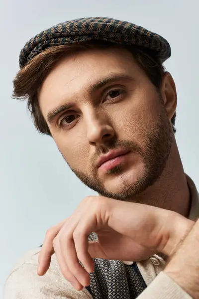 A young man exudes charm and confidence with his elegant dandy style. — Stock Photo