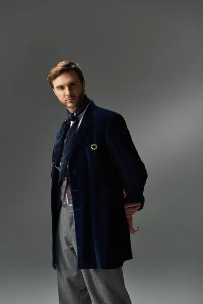 A handsome figure showcases a sophisticated fashion sense with sleek accessories and refined attire. — Stock Photo