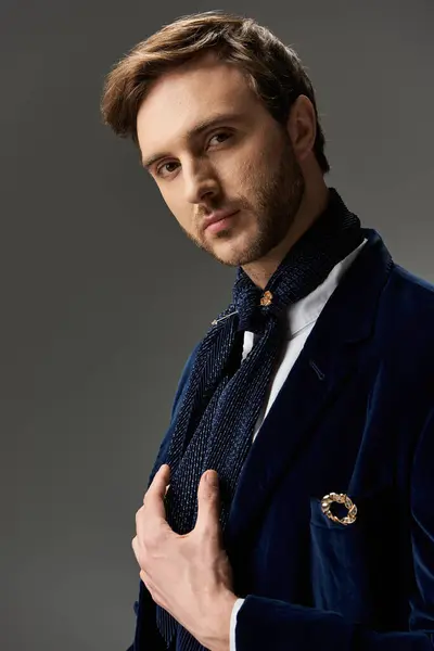 A handsome dandy poses confidently, highlighting his stylish outfit and elegant accessories. — Stock Photo