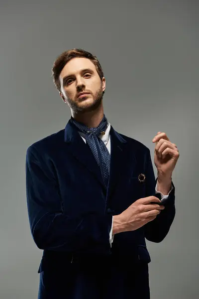 A handsome dandy stands confidently, exuding charm and elegance in a stylish outfit. — Stock Photo