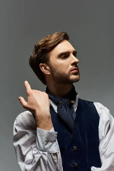 A handsome dandy showcases his unique style, striking a thoughtful pose in elegant attire. — Stock Photo