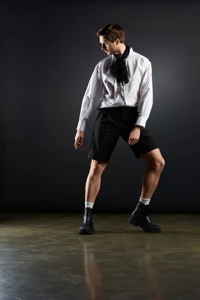 A handsome young man showcases his unique style with confidence in a modern setting. — Stock Photo