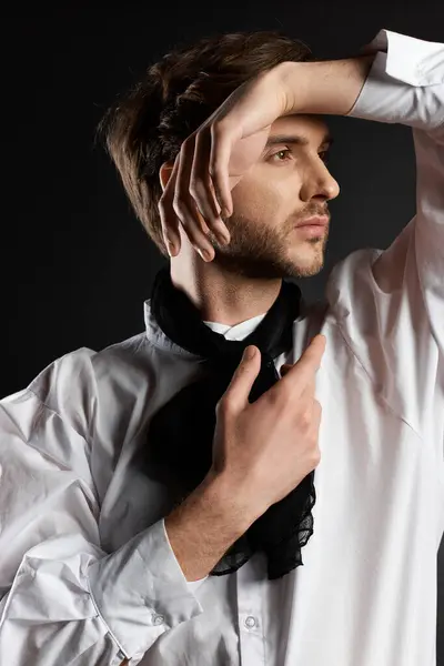 The dandy strikes a thoughtful pose, showcasing fashion with charm and sophistication. — Stock Photo