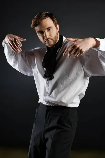A striking young man showcases his style with flair, embodying elegance and confidence while posing. — Stock Photo