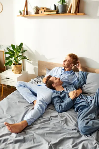Two loving partners enjoy a peaceful morning in pajamas, sharing laughter and warmth in their cozy home. — Stock Photo