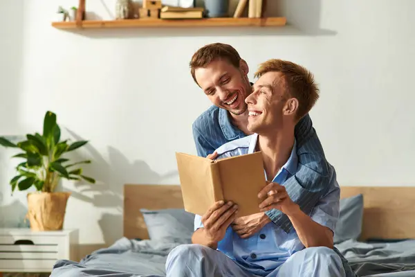 Two partners share laughter and love while enjoying a peaceful morning together in their pajamas. — Stock Photo