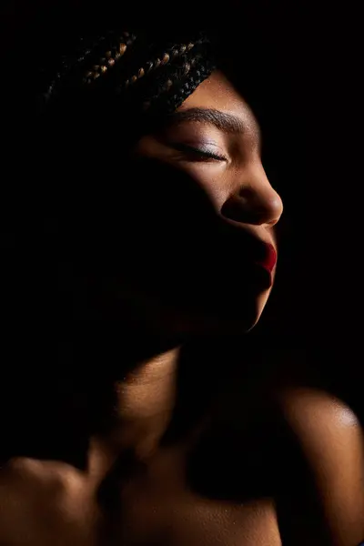 A young African American woman confidently poses and striking red lips. — Stock Photo