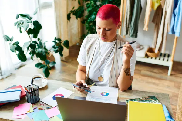 Focused on her tasks, a young woman works creatively at her cozy home workspace. — Stock Photo