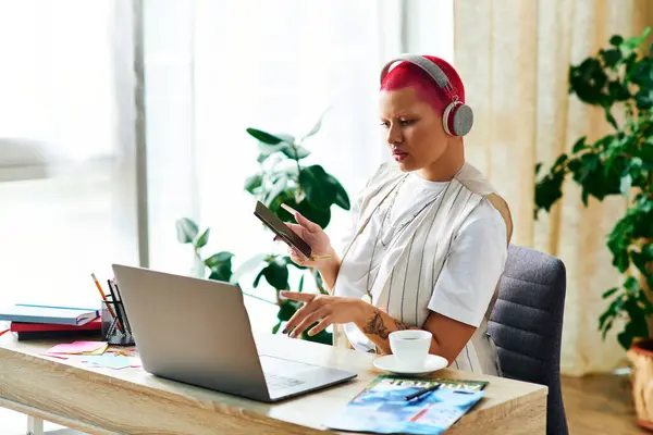 The young woman channels her creativity at home, combining music with digital tasks at her desk. — Stock Photo
