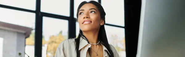 A young woman in an elegant outfit inspires motivation while working in a contemporary office. — Stock Photo