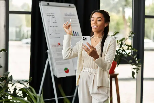 A young woman enthusiastically presents ideas in an airy office adorned with plants and charts. — Stock Photo