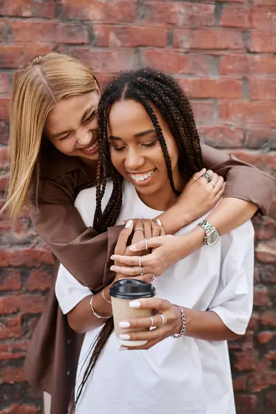 A happy multiethnic couple shares a tender moment, embracing each other with joy and laughter. — Stock Photo