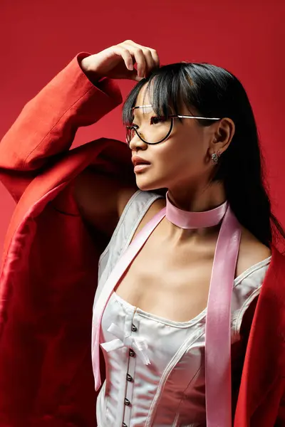 A stylish Asian woman poses confidently, showcasing her unique fashion sense and elegance. — Stock Photo