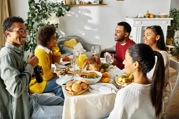 Friends share a joyful Thanksgiving dinner of food, laughter, and great company. — Stock Photo