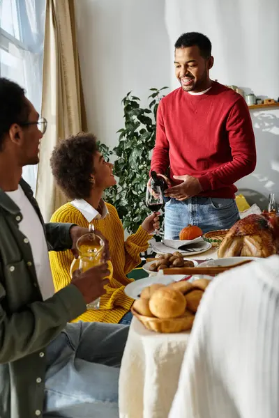 Friends share a heartfelt Thanksgiving celebration filled with laughter, food, and joy. — Stock Photo