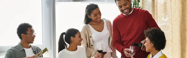 A group of friends enjoy a festive Thanksgiving together, sharing gratitude and laughter. — Stock Photo