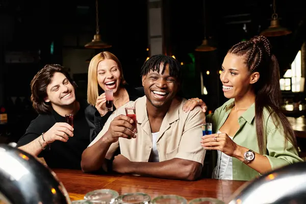 A group of young professionals shares joyful moments while toasting at a lively corporate gathering. — Stock Photo