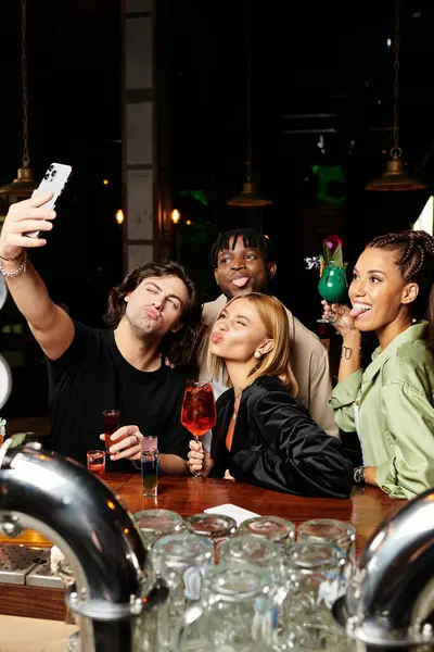 Young diverse colleagues enjoy a lively corporate gathering, capturing a fun moment together. — Stock Photo