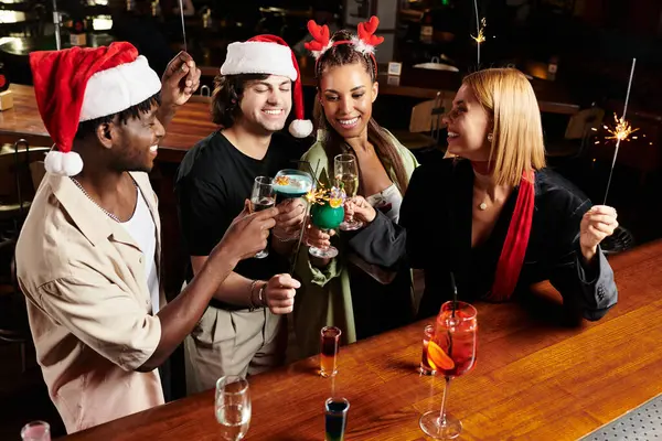 Young professionals gather, raising glasses in festive cheer during a corporate celebration. — Stock Photo