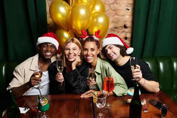 Colleagues enjoy drinks and festive moments together, celebrating teamwork and camaraderie. — Stock Photo