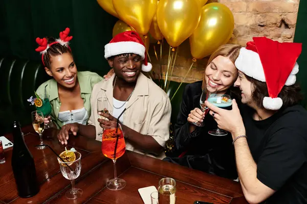 A lively gathering of diverse coworkers enjoying drinks and laughter during a festive celebration. — Stock Photo