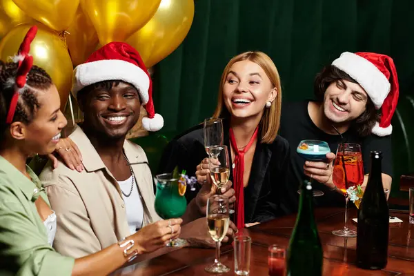 Diverse coworkers raise their glasses in a joyful toast at a lively corporate holiday celebration. — Stock Photo