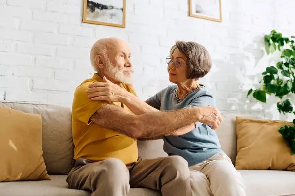 A devoted couple at home, the wife provides care and support to her husband living with diabetes. — Stock Photo