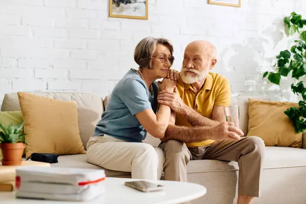A devoted wife comforts her husband with diabetes, sharing moments of love and support at home. — Stock Photo