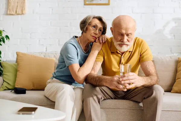 A loving wife offers comfort to her husband as he deals with diabetes in their serene home. — Stock Photo