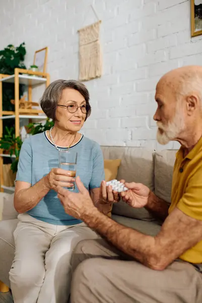 A devoted wife supports her husband with diabetes as they manage his health together. — Stock Photo