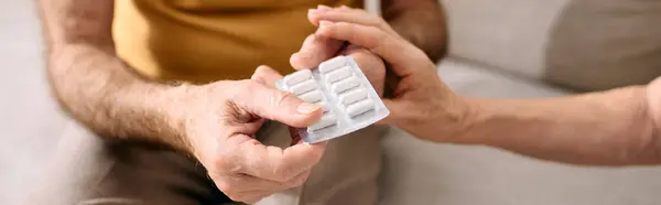 A devoted wife assists her husband in managing his diabetes, offering care and compassion. — Stock Photo