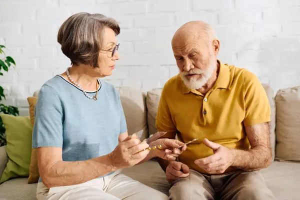A loving couple engages in diabetes care, showcasing tenderness and support at home. — Stock Photo