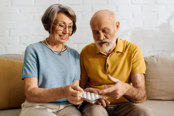 A devoted wife helps her husband manage diabetes while sharing a warm moment at home. — Stock Photo